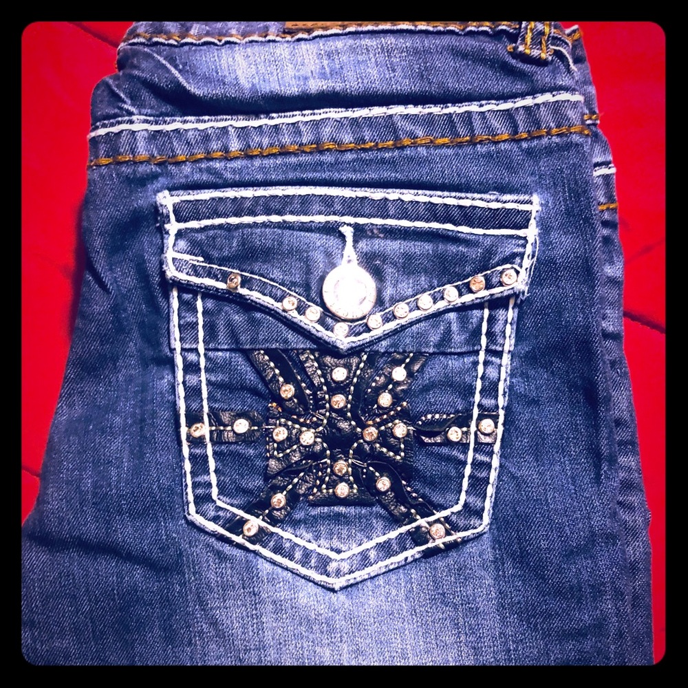 Woman’s Premier distressed jeans from Rue 21